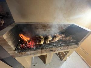 a grill with meat and skulls on top of it at Il Germoglio in Bisceglie
