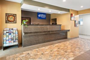 a mcdonalds restaurant with a cash counter in a lobby at Americas Best Value Inn Somerville Texas in Somerville