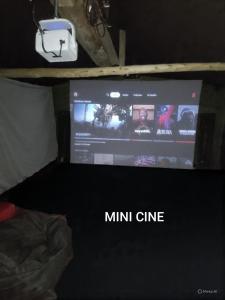 a tv in a room with a mini crime sign on it at Domo La Esmeralda Glamping Familiar 5P in Nobsa