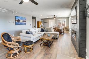 a living room with a couch and a table at Waterfront Deck, Shell Knob Gem on Table Rock! in Shell Knob