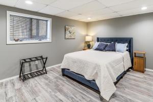a bedroom with a bed and a window at Waterfront Deck, Shell Knob Gem on Table Rock! in Shell Knob