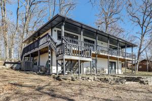 a large house with a large deck on the side of it at Waterfront Deck, Shell Knob Gem on Table Rock! in Shell Knob