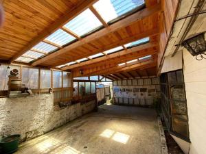 an inside view of a barn with a skylight at Chiloe Seta in Ancud