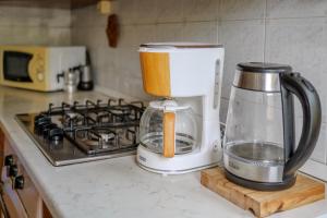 a food processor sitting on a counter next to a stove at B&BTorre Cives in Vidracco