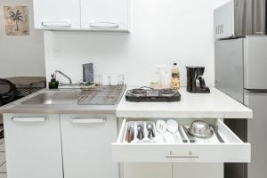 a kitchen with a sink and a white counter top at Departamento Palmito in La Paz