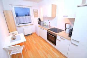 Kuchyň nebo kuchyňský kout v ubytování Apartments Hemer