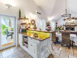 a kitchen with a counter and a dining room at Holiday Home Villa Mutnik by Interhome in Mirce