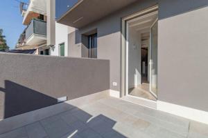 an external view of a house with a glass door at Apartment-Boutique Gioia in Cittadella