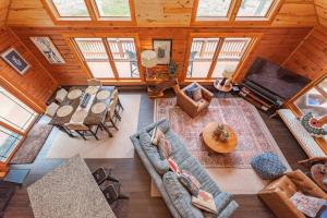 an overhead view of a living room with furniture and a television at Crows Nest by Railey Vacations in Swanton