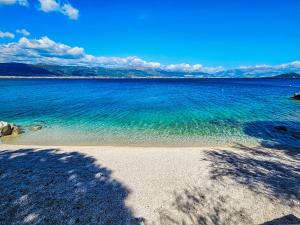 a view of a beach with the blue water at Holiday Home Robert by Interhome in Trogir