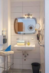 a bathroom with a sink and a mirror at Haus Ladner in See +68 photos