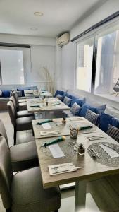 a group of tables and chairs in a room at Diamante Paguera Boutique Hotel in Paguera