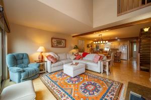 a living room with a white couch and blue chairs at DC Love Shack by Railey Vacations in McHenry +31 photos