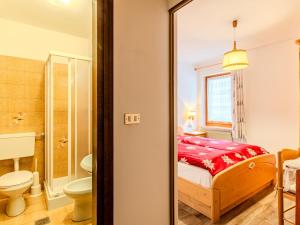 a bathroom with a bed and a toilet and a shower at Apartment Cristina by Interhome in Campestrin
