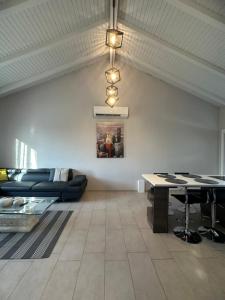 a living room with a couch and a table at Theros 1 in Xanthi
