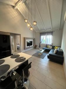 a living room with a couch and a table at Theros 1 in Xanthi