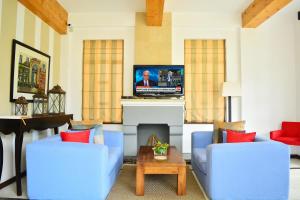 TV in/ali zabaviščno središče v nastanitvi Unique Cottages