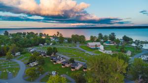 an aerial view of a resort with a lake at Sun Outdoors Association Island in Henderson Harbor