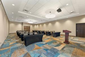a conference room with tables and chairs and a podium at Drury Plaza Hotel Lincoln Downtown in Lincoln +63 photos