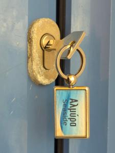 a key chain with the words door closed on a door at Almyra seaside in Perdika +50 photos