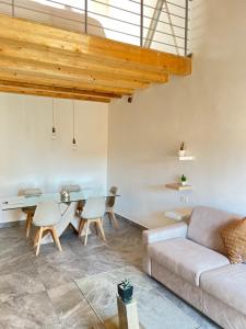 a living room with a couch and a table at R&V Apartments - Nel cuore di La Spezia in La Spezia