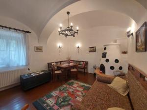 a living room with a couch and a table at Siske malom in Balatonfüred