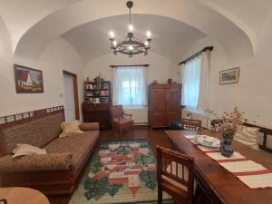 a living room with a couch and a table at Siske malom in Balatonfüred +15 photos