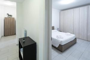 a bedroom with a bed and a tv in it at Casa Cesari in Ponte Ronca