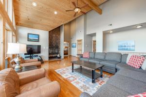 a living room with a couch and a table at Rocky Mountain Lodge by Railey Vacations in McHenry