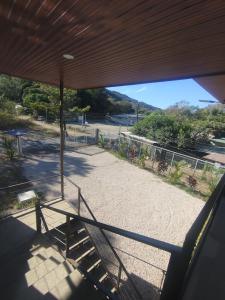 a view from the porch of a building with a staircase at Las Morenas in Nosara