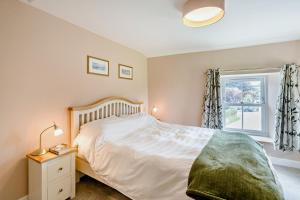 a bedroom with a bed and a window at 2 Bed in Ormathwaite oc-s32385 in Applethwaite