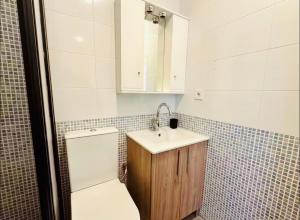 a bathroom with a toilet and a sink at Muy bien in San Javier +15 photos