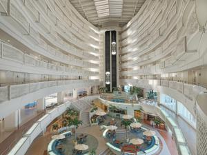 an overhead view of a shopping mall with a large building at ANA InterContinental Manza Beach Resort by IHG in Onna