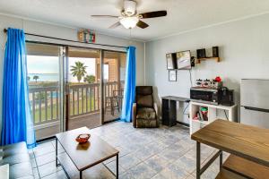 a living room with a view of the ocean at Steps to North Beach: Gem w/ Ocean-View Balcony! in Corpus Christi