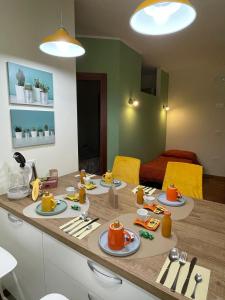 a kitchen with a table with plates of food on it at Il Piccolo Scrigno 2 in Lonigo