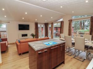 a living room with a couch and a table at Beech Hill Lodge Beech Hill 9 at Fallbarrow Park in Windermere