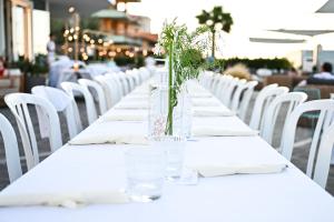 a long table with white tables and white chairs at Hotel Mexico in Bellaria-Igea Marina