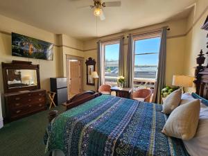 a bedroom with a bed and a view of the ocean at Hotel Planter in La Conner