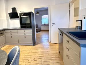 a kitchen with a tv on top of a counter at Altstadt Apartment Deluxe 3 in Haltern