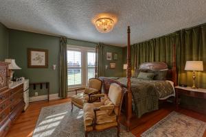 a bedroom with a bed and a chair at The Allen House in Ridgefield +14 photos