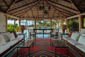 an outdoor living room with couches and tables at La Valise Los Cabos, Member of Small Luxury Hotels in Boca de la Vinorama +35 photos