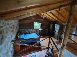an overhead view of a bedroom in a log cabin at Stone Cabin, PETRA HAUS in Cuesta Blanca