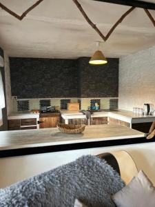 a kitchen with a large island in the middle at Chambre d'hôte Mara in Corlay