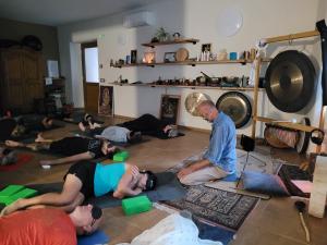 a group of people in a living room doing yoga at Casa Sole in Ceniga