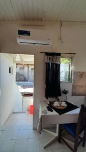 a small room with a table and a window at Hostel en Almirante Brown in Villa Martín Arín