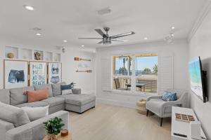a living room with a couch and a window at Beach Escape, King Suite, Ocean Views, Pet Friendly in Destin