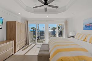 a bedroom with a bed and a ceiling fan at Beach Escape, King Suite, Ocean Views, Pet Friendly in Destin