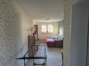 a living room with a bench and a couch at Lewitz-Urlaub in Lübesse