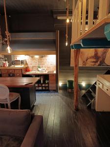 a kitchen with a couch and a table in a room at sweet home in Biella
