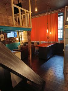 a restaurant with a bench in the middle of a room at sweet home in Biella